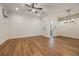 Bright and airy living room with wood floors and modern lighting fixtures at 1457 Resolute St, Celebration, FL 34747