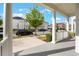 Inviting porch view showcasing the neighborhood's charming street and lush trees at 1457 Resolute St, Celebration, FL 34747