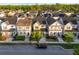 Charming homes with front porches line a peaceful street, showcasing the community's inviting atmosphere at 1457 Resolute St, Celebration, FL 34747