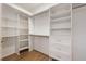 Well-organized walk-in closet with built-in shelving, drawers, and ample hanging space for storage at 1457 Resolute St, Celebration, FL 34747