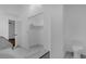 Spacious bathroom features modern fixtures, including a toilet and walk-in closet at 1563 W Finland Dr, Deltona, FL 32725