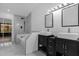 Modern bathroom showcasing dual vanities, a tub and shower combo, and stylish finishes at 1563 W Finland Dr, Deltona, FL 32725