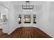 Charming dining area features stylish lighting and large bay windows, creating a bright and inviting space at 1563 W Finland Dr, Deltona, FL 32725