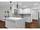 Bright kitchen features a large island with quartz countertop, stainless steel appliances, and modern finishes at 1563 W Finland Dr, Deltona, FL 32725
