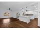 Open-concept living area with modern lighting and wood-look tile flooring offers a welcoming and spacious atmosphere at 1563 W Finland Dr, Deltona, FL 32725
