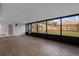 Enclosed patio with tile flooring and large windows overlooking the fenced backyard at 1563 W Finland Dr, Deltona, FL 32725