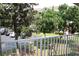 Balcony view overlooking the community's landscaped grounds and parking area at 1969 Summer Club Dr # 209, Oviedo, FL 32765