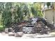 Scenic community entrance showcasing stone waterfall and lush landscaping at 1969 Summer Club Dr # 209, Oviedo, FL 32765