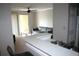 Living room with a sliding glass door to the balcony, ceiling fan and neutral colors at 1969 Summer Club Dr # 209, Oviedo, FL 32765