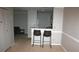 Open concept living room flows seamlessly to the kitchen with barstool seating at 1969 Summer Club Dr # 209, Oviedo, FL 32765