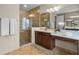 Beautiful bathroom with walk-in shower, vanity, and tile flooring at 2107 Rickover Pl, Winter Garden, FL 34787
