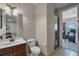 Clean bathroom with a modern sink, toilet, and glass shower, providing a functional and stylish space at 2107 Rickover Pl, Winter Garden, FL 34787