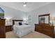 Cozy bedroom featuring light blue walls, carpet flooring, and classic wood furniture at 2107 Rickover Pl, Winter Garden, FL 34787