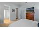 Bedroom showcasing neutral carpet, a TV atop a dresser, and access to the bathroom at 2107 Rickover Pl, Winter Garden, FL 34787