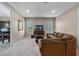 Inviting bonus room with ample seating, soft carpeting, and a media center at 2107 Rickover Pl, Winter Garden, FL 34787
