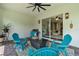 Covered patio with a ceiling fan, table and chairs, and view into home at 2107 Rickover Pl, Winter Garden, FL 34787