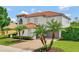 Charming, well-maintained home with a 2-car garage, balcony, lush landscaping, and a brick driveway at 2107 Rickover Pl, Winter Garden, FL 34787