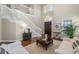 Welcoming foyer with high ceilings, elegant staircase, and hardwood flooring at 2107 Rickover Pl, Winter Garden, FL 34787