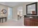 Hallway featuring a wet bar, views of an upstairs loft and a bedroom at 2107 Rickover Pl, Winter Garden, FL 34787