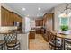 Bright kitchen featuring stainless steel appliances, custom cabinets, granite counters and an eat-in nook at 2107 Rickover Pl, Winter Garden, FL 34787