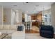 Spacious living room with hardwood floors flowing into an open kitchen area at 2107 Rickover Pl, Winter Garden, FL 34787