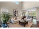 Airy living room with high ceilings, hardwood floors, neutral paint, and multiple windows at 2107 Rickover Pl, Winter Garden, FL 34787
