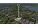 Spacious home with a pool in a neighborhood near the water, surrounded by lush trees at 218 Nettlewood Ln, Fern Park, FL 32730