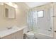 Bright bathroom with a tub, shower, toilet and sink with decorative mirror and lighting at 218 Nettlewood Ln, Fern Park, FL 32730