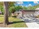 Charming home featuring an attached garage, well-maintained lawn, and a quaint walkway to the front door at 218 Nettlewood Ln, Fern Park, FL 32730