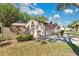 A well kept condo featuring a single car garage, grassy lawn, and an American flag out front at 218 Nettlewood Ln, Fern Park, FL 32730