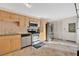 Bright kitchen featuring stainless steel appliances, wood cabinets, and tile flooring for easy maintenance at 218 Nettlewood Ln, Fern Park, FL 32730