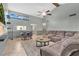 Bright living room boasts high ceilings, a large sectional sofa, and an open layout perfect for entertaining at 218 Nettlewood Ln, Fern Park, FL 32730