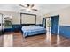 Spacious main bedroom with hardwood floors, ceiling fan and large sliding glass doors to the outdoor area at 218 Nettlewood Ln, Fern Park, FL 32730