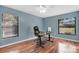 Bright office with a fan, desk and lots of natural light from the two windows at 218 Nettlewood Ln, Fern Park, FL 32730
