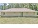 Expansive backyard featuring a sliding glass door entry into the home at 22 Laurel Crse, Ocala, FL 34480