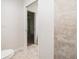 Bathroom featuring a tiled walk-in shower and ensuite bedroom at 22 Laurel Crse, Ocala, FL 34480