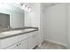 Bathroom featuring a double vanity sink, tile floor, and ample cabinet space at 22 Laurel Crse, Ocala, FL 34480
