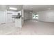 Open-concept kitchen featuring granite countertops and modern white cabinetry at 22 Laurel Crse, Ocala, FL 34480