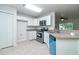 Modern kitchen featuring stainless steel appliances, granite countertops, and white cabinetry at 22 Laurel Crse, Ocala, FL 34480