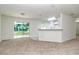 Bright and airy living room with sliding glass doors and an open view of the kitchen at 22 Laurel Crse, Ocala, FL 34480