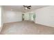 Open-concept living room with neutral carpet and multiple entry points at 22 Laurel Crse, Ocala, FL 34480