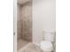 Tiled walk-in shower with neutral colors and tiled floors and walls at 22 Laurel Crse, Ocala, FL 34480