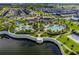 Stunning aerial view of the community pool, clubhouse, and surrounding homes in a Primary-planned development at 2352 Zaballina Pl, Kissimmee, FL 34747