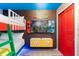 Unique ' bedroom with Super Mario themed decor, brick walls, bunk beds, and mounted TV at 2352 Zaballina Pl, Kissimmee, FL 34747