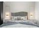 Elegant bedroom featuring a large gray headboard bed with lamps, modern light fixtures, and white molding at 2352 Zaballina Pl, Kissimmee, FL 34747