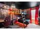 Nicely decorated Harry Potter themed bedroom featuring a bunk bed, brick accent wall, and themed lighting at 2352 Zaballina Pl, Kissimmee, FL 34747