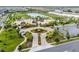 This aerial view shows a residential community, with a pool and lake at 2352 Zaballina Pl, Kissimmee, FL 34747