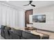 Cozy living room featuring a large TV, contemporary decor, neutral tones, and natural lighting at 2352 Zaballina Pl, Kissimmee, FL 34747