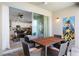 This patio has a table with chairs and access to the house through glass sliding doors at 2352 Zaballina Pl, Kissimmee, FL 34747