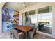 This patio has a table with chairs and access to the house through glass sliding doors at 2352 Zaballina Pl, Kissimmee, FL 34747